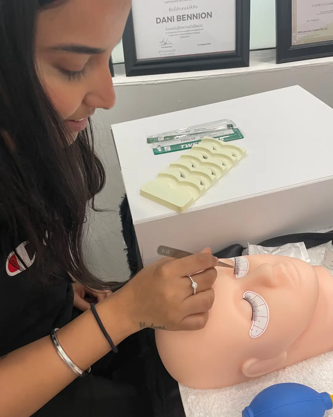 Student learning lash mapping on mannequin during lash extension course Brisbane